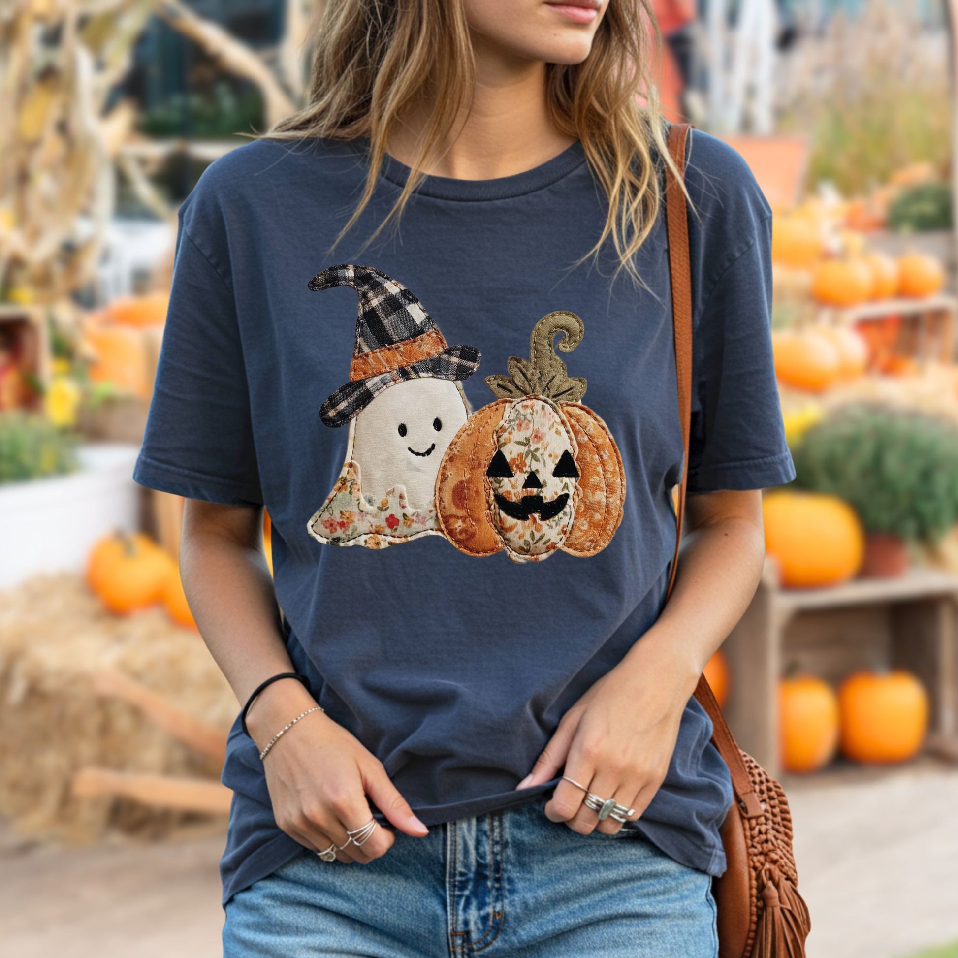 Navy Comfort Colors t-shirt with a faux patchwork ghost in a plaid hat and a jack o'lantern.