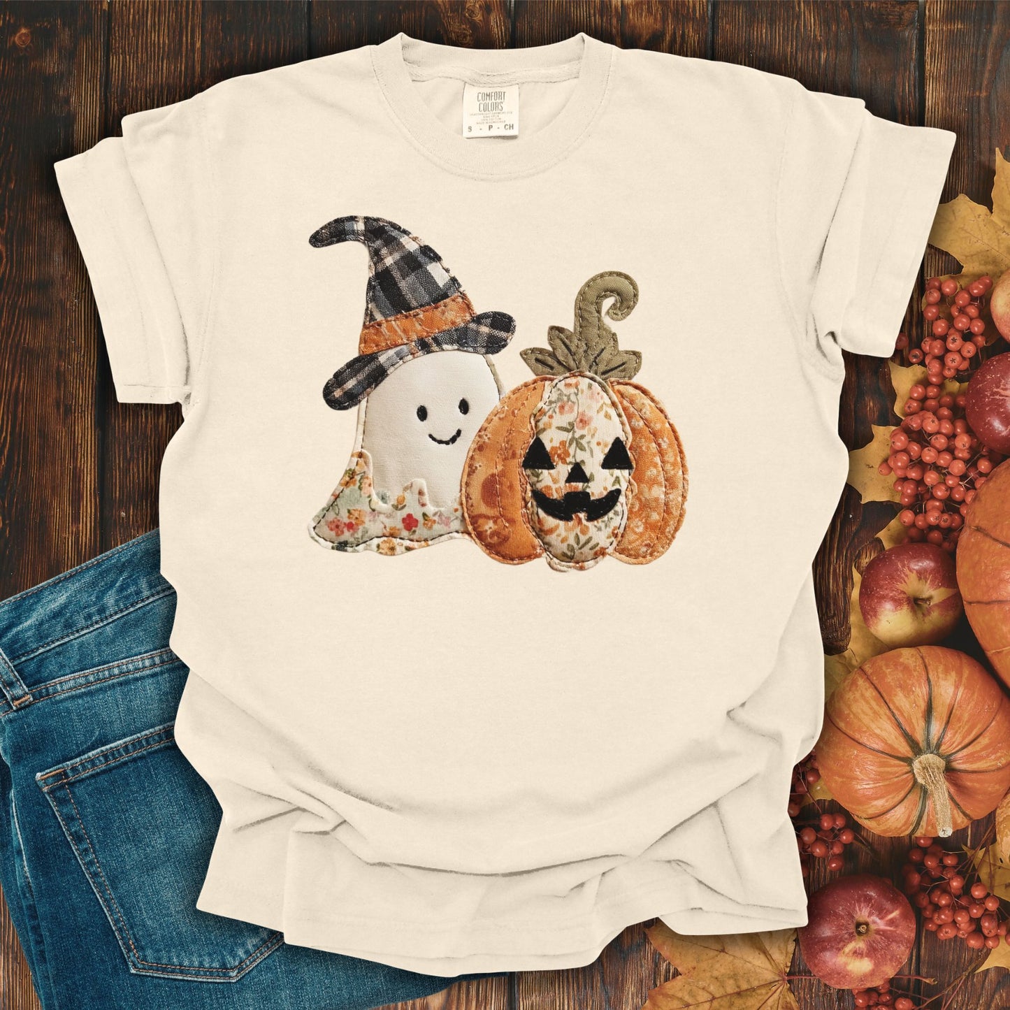 Ivory Comfort Colors t-shirt with a faux patchwork ghost in a witch hat and a jack-o'-lantern.