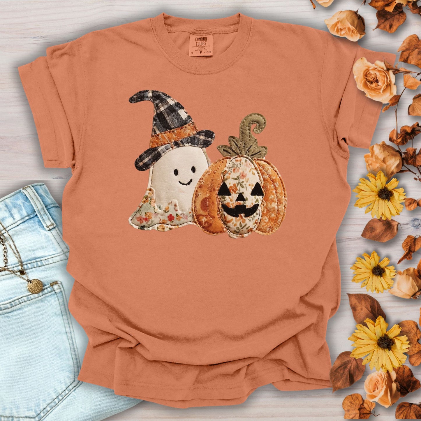 Yam Comfort Colors t-shirt with a faux patchwork ghost in a plaid witch hat and a floral jack o'lantern.