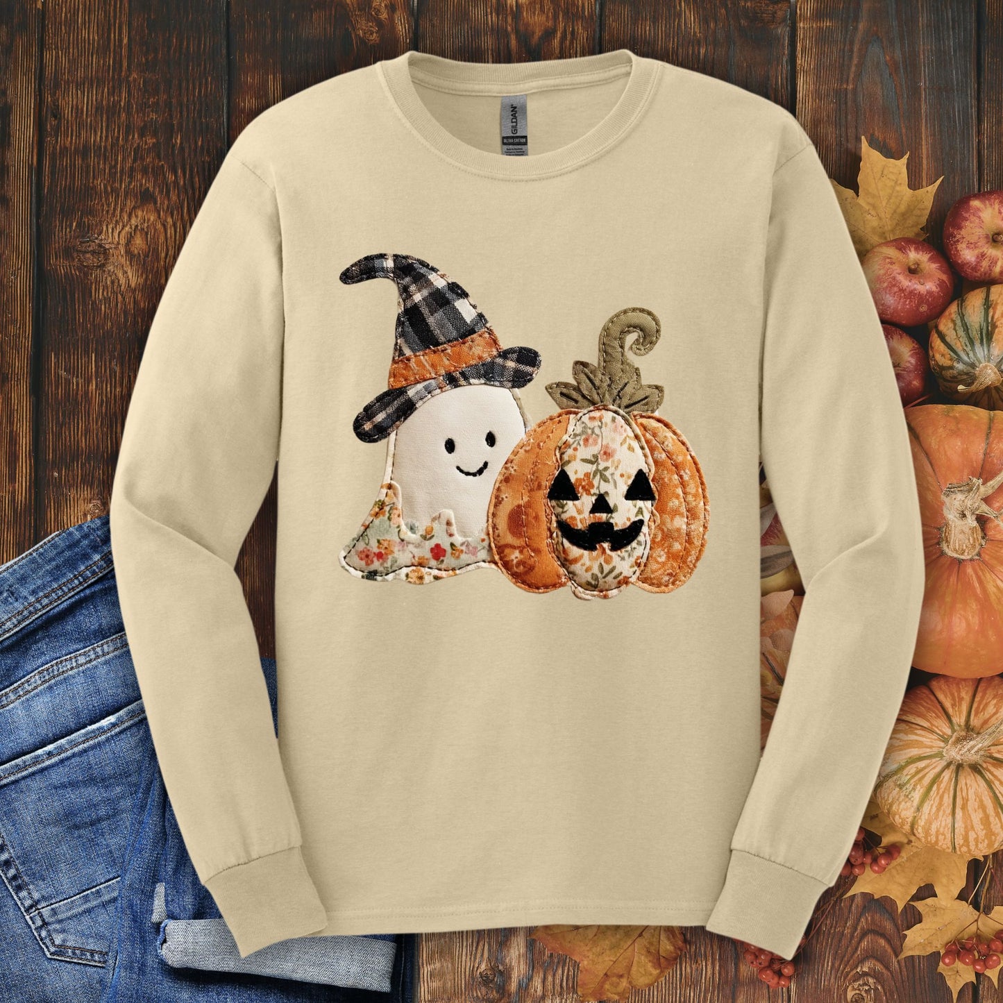 Sand long sleeve tee with a faux patchwork ghost in a plaid witch hat and a floral pumpkin.