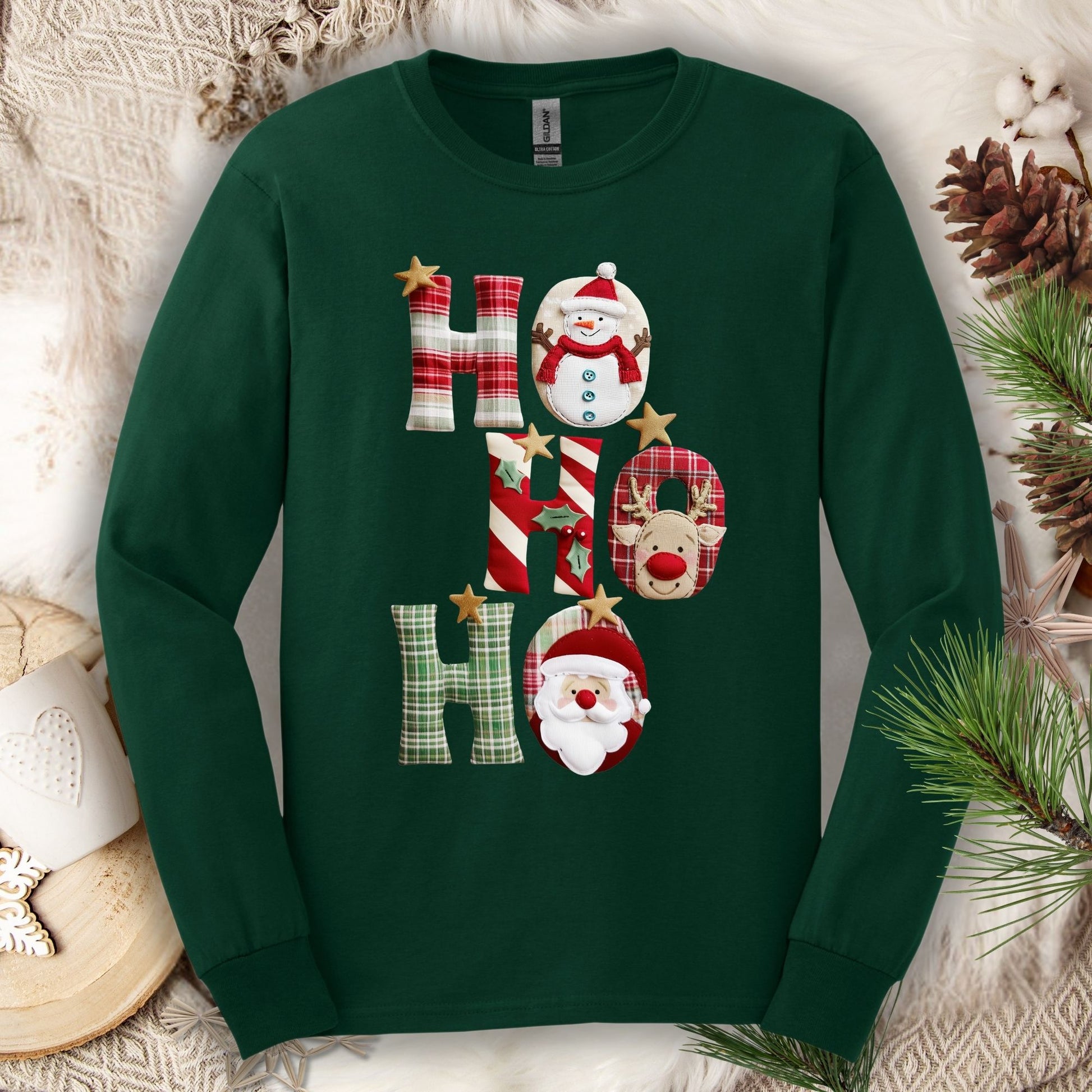 Forest Green 100% cotton long sleeve tee with faux patchwork "Ho Ho Ho" featuring Santa, Rudolph, and a snowman.