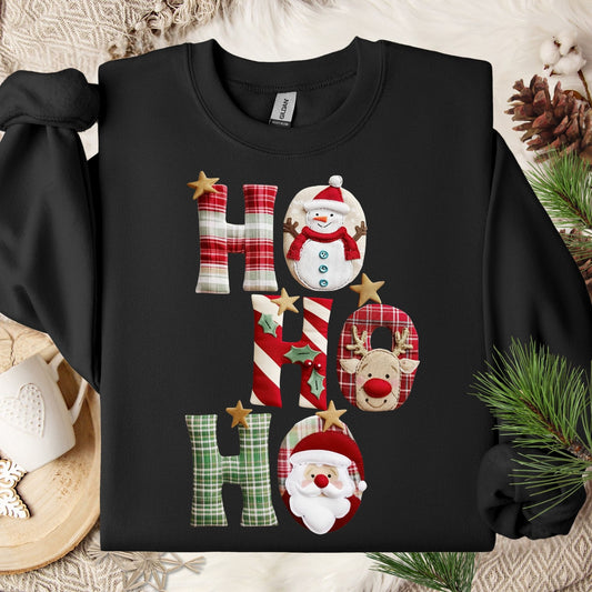 Black Gildan crewneck sweatshirt with faux patchwork "Ho Ho Ho" design featuring Santa, Rudolph, and a snowman.