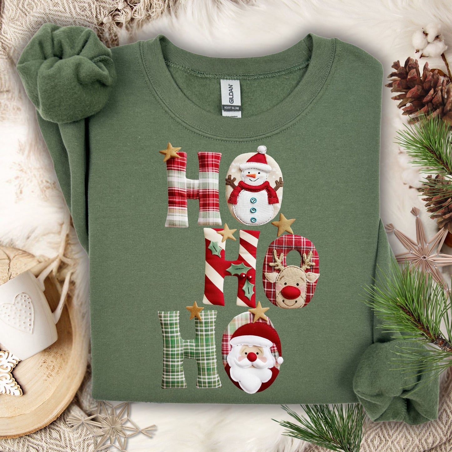 Military Green Gildan sweatshirt with faux patchwork "Ho Ho Ho" featuring Santa, Rudolph, and a snowman.