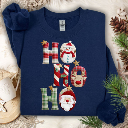 Navy crewneck sweatshirt with faux patchwork "Ho Ho Ho" design featuring Santa, Rudolph, and a snowman.