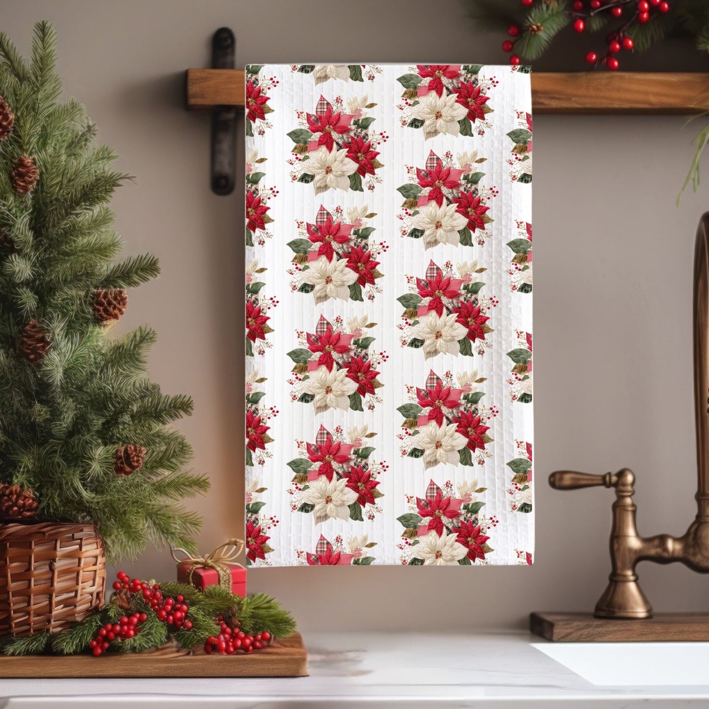 Microfiber tea towel with faux patchwork red and cream poinsettias, hanging in a festive kitchen.