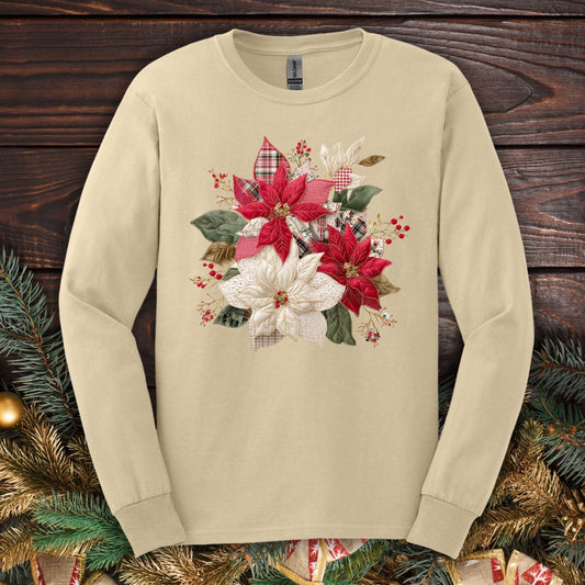 Sand long sleeve tee with a faux patchwork poinsettia design featuring red, white, gingham, and plaid details.