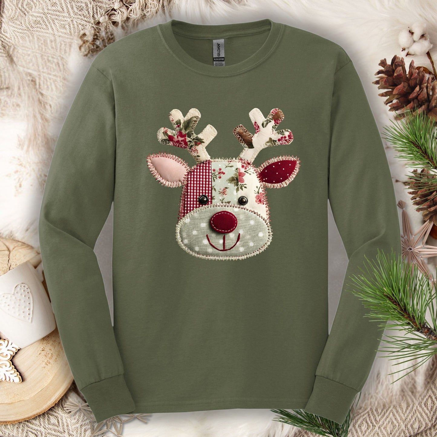 Military Green S long sleeve tee with a faux patchwork Rudolph design in sage green, deep red, and floral patterns.