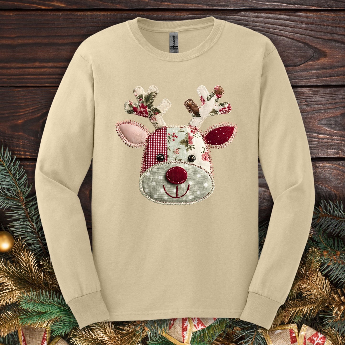 Sand long sleeve Gildan tee with a printed patchwork Rudolph design in sage green, deep red, and white.