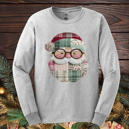 Ash long sleeve tee with a printed patchwork Santa face in red, cream, and green.
