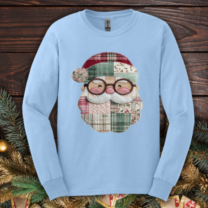 Light blue long sleeve tee with a printed patchwork Santa face in red, cream, and green country fabrics.