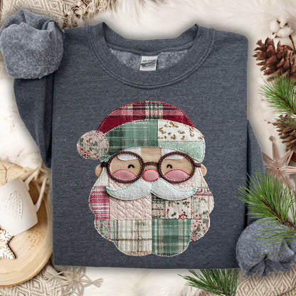 Dark Heather Gildan sweatshirt with a printed faux patchwork Santa design in soft Christmas tones.