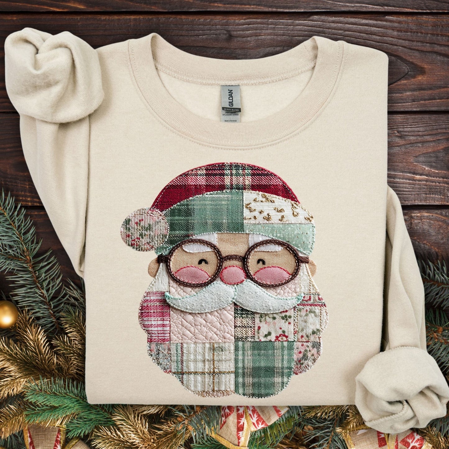 Sand Gildan sweatshirt with a printed faux patchwork Santa design, featuring soft Christmas tones and cottagecore details.
