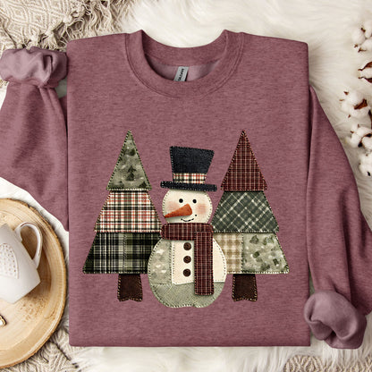 Heather Sport Dark Maroon sweatshirt with a faux patchwork snowman and evergreen trees design.