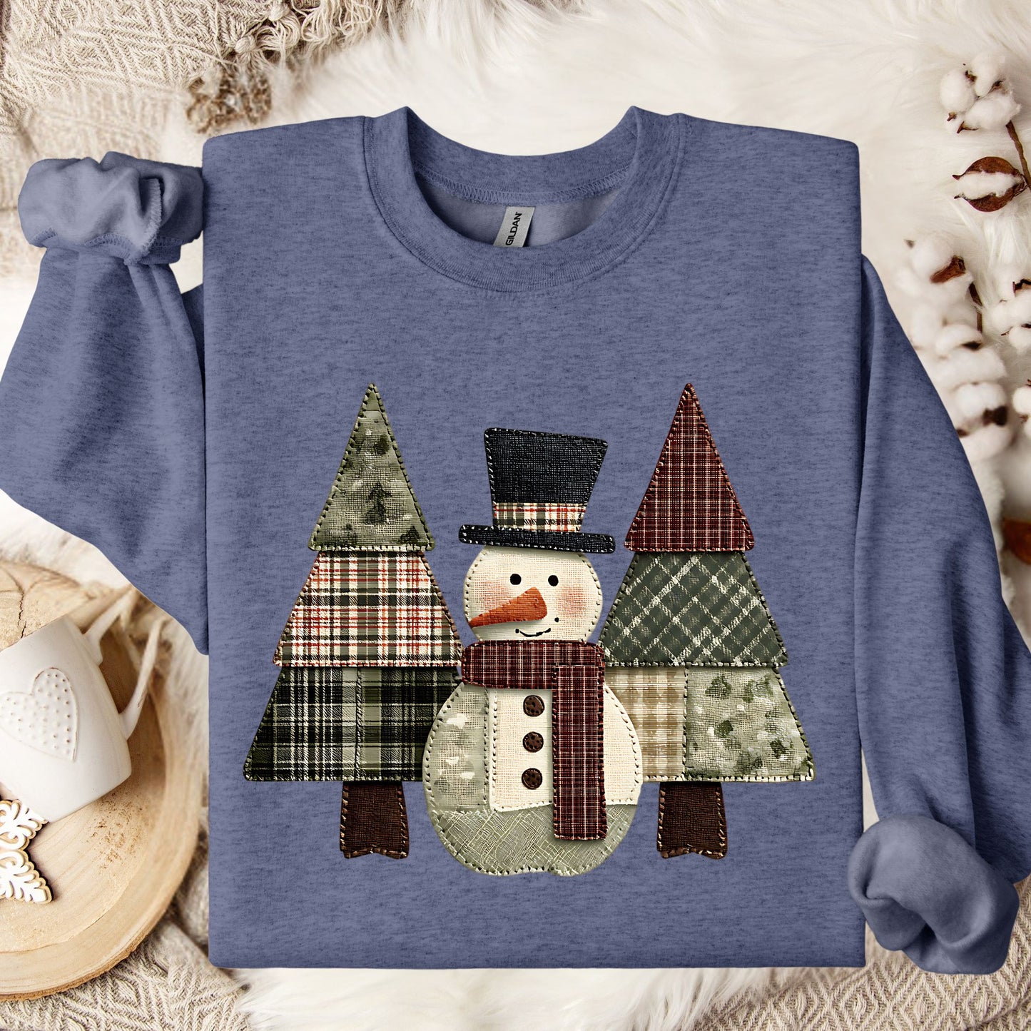 Heather Sport Dark Navy crewneck sweatshirt with a faux patchwork snowman and evergreen trees.