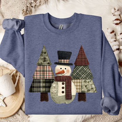 Heather Sport Dark Navy crewneck sweatshirt with a faux patchwork snowman and evergreen trees.