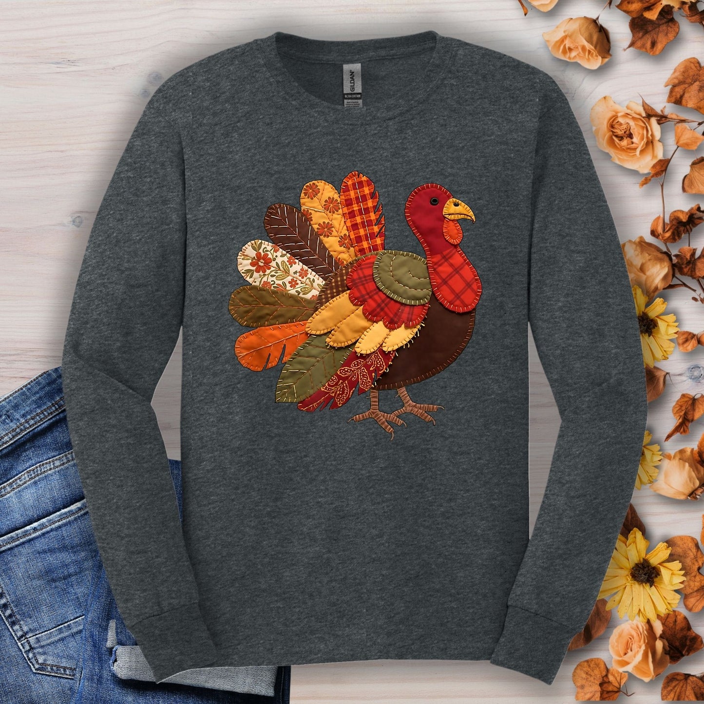Dark heather long sleeve tee with a colorful faux patchwork Thanksgiving turkey design.