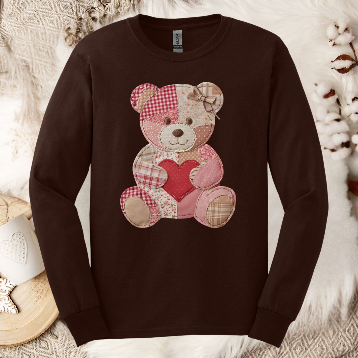 Dark Chocolate long-sleeve tee with a faux patchwork teddy bear holding a red heart.