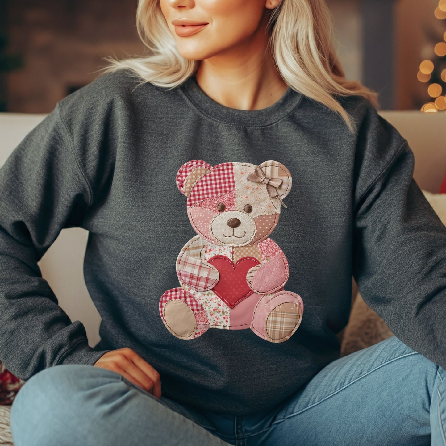 Charcoal crewneck sweatshirt with a vintage patchwork teddy bear holding a red heart.