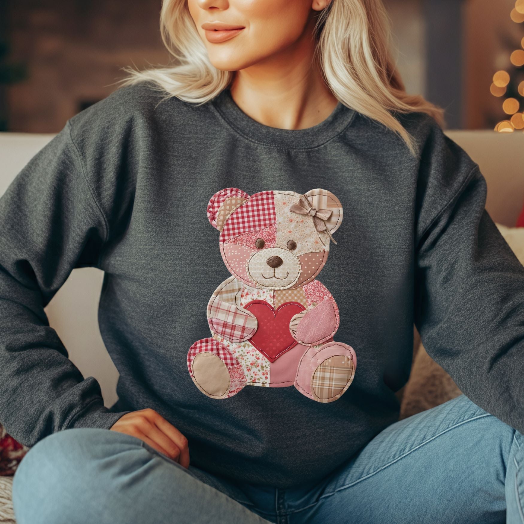 Charcoal crewneck sweatshirt with a vintage patchwork teddy bear holding a red heart.