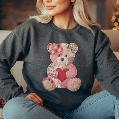 Charcoal crewneck sweatshirt with a vintage patchwork teddy bear holding a red heart.