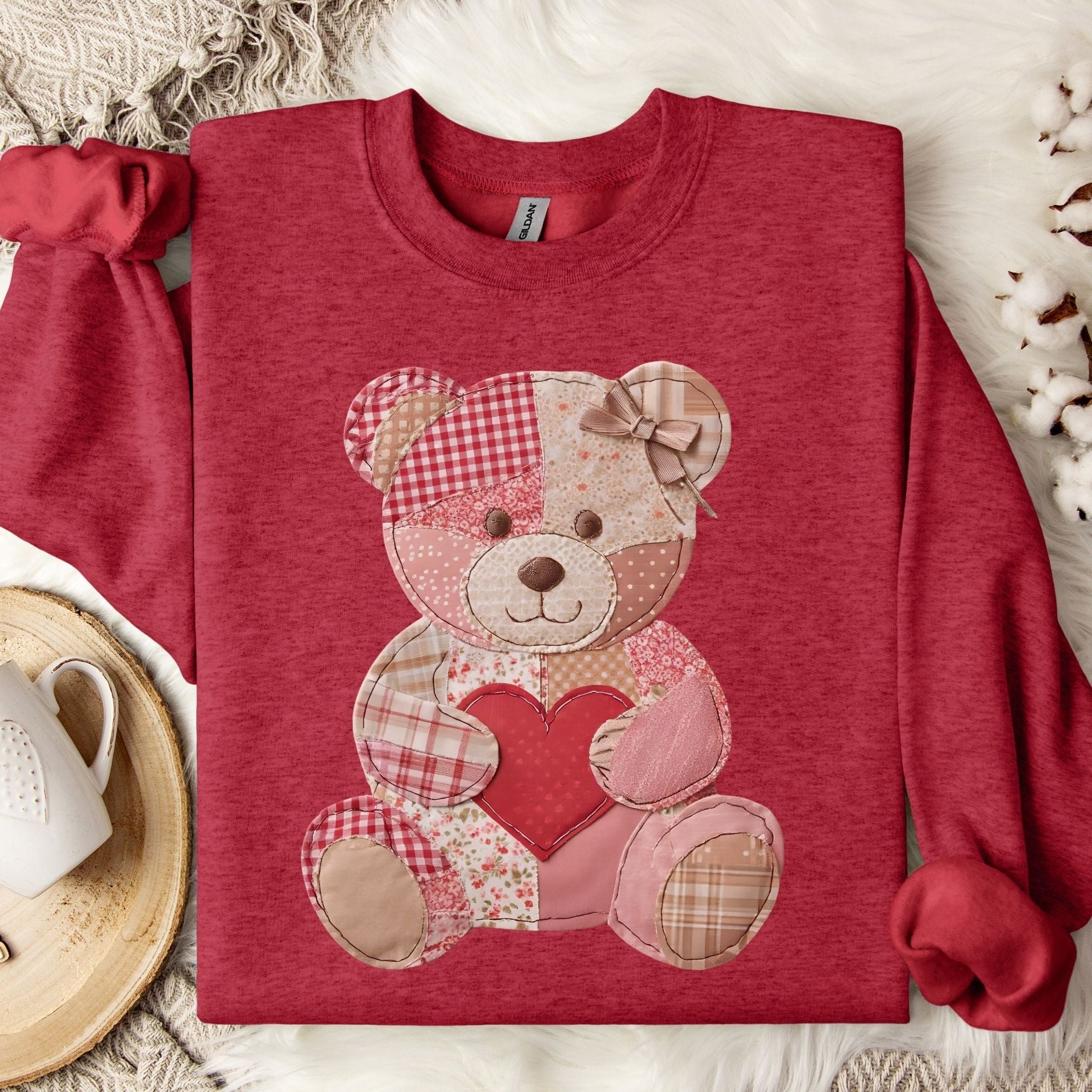 Antique Cherry Red sweatshirt with a faux patchwork teddy bear holding a heart.