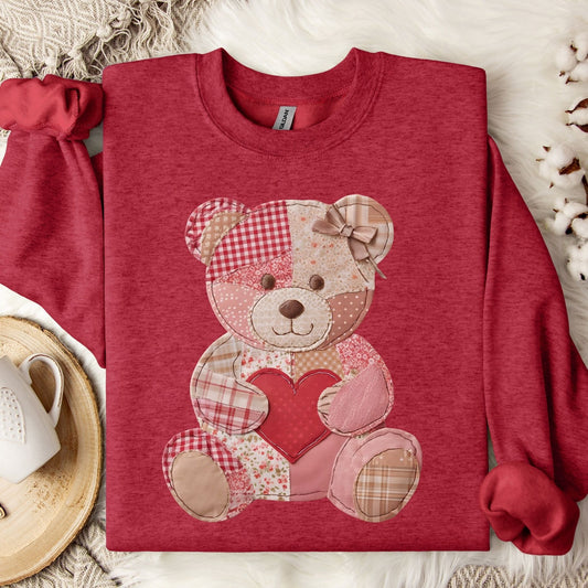 Antique Cherry Red sweatshirt with a faux patchwork teddy bear holding a heart.