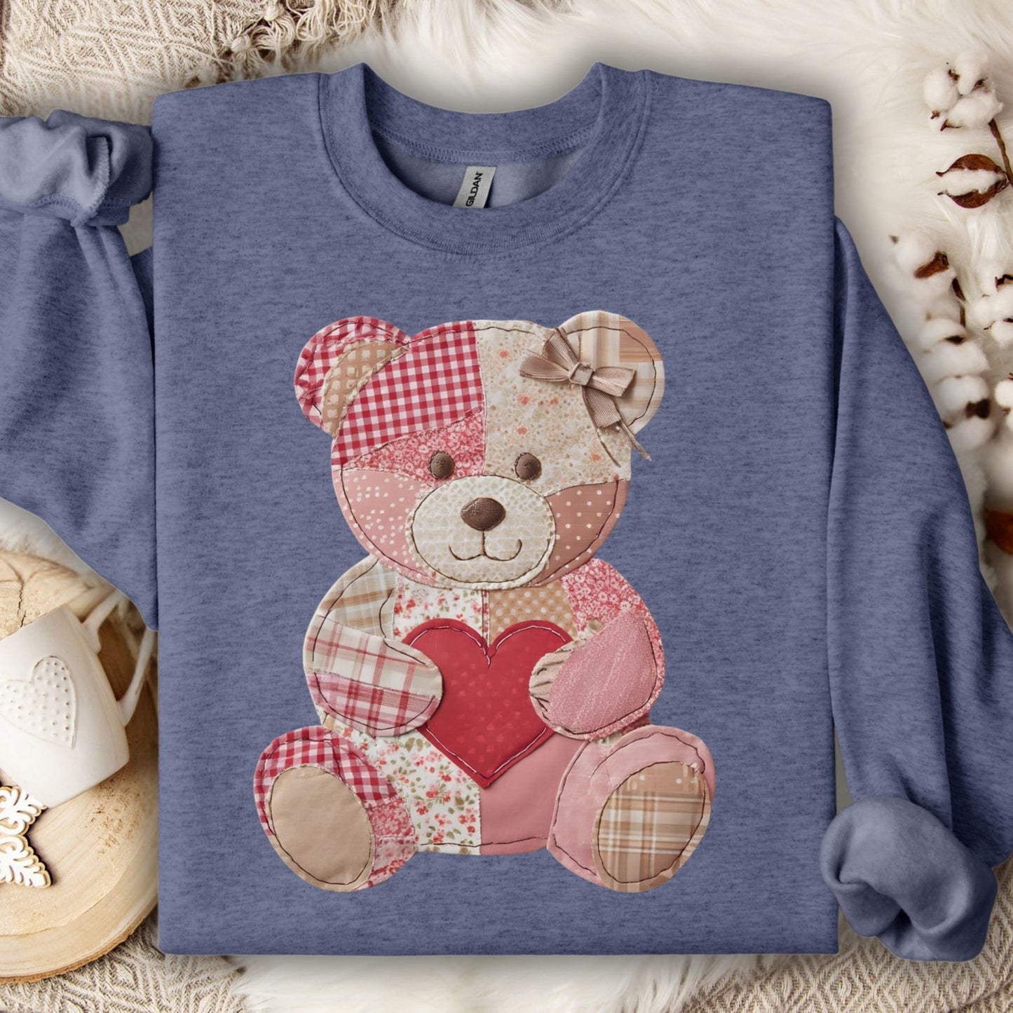 Heather Sport Dark Navy sweatshirt with a faux patchwork teddy bear holding a red heart.