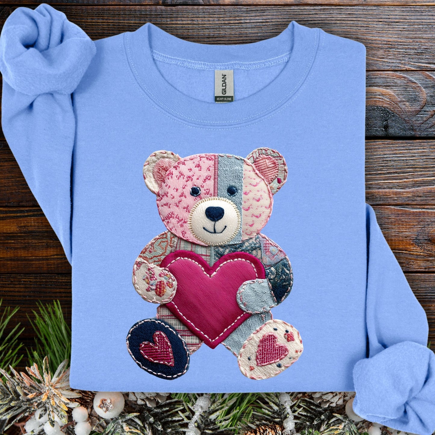 Carolina Blue Faux Patchwork Valentine's Teddy Bear Sweatshirt with a printed teddy holding a heart.