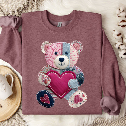 Heather Sport Dark Maroon sweatshirt with a printed faux patchwork teddy bear holding a pink heart.