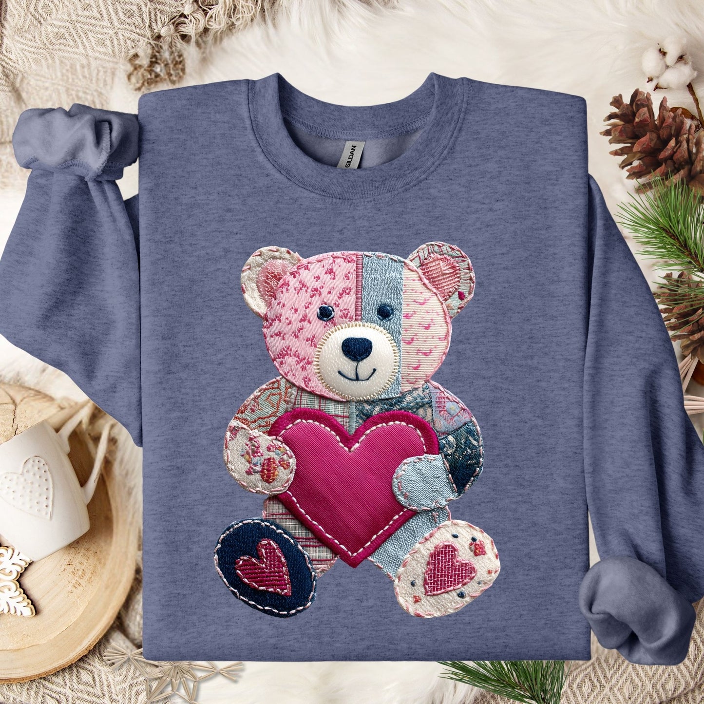 Heather Sport Dark Navy sweatshirt with a printed faux patchwork teddy bear holding a pink heart.
