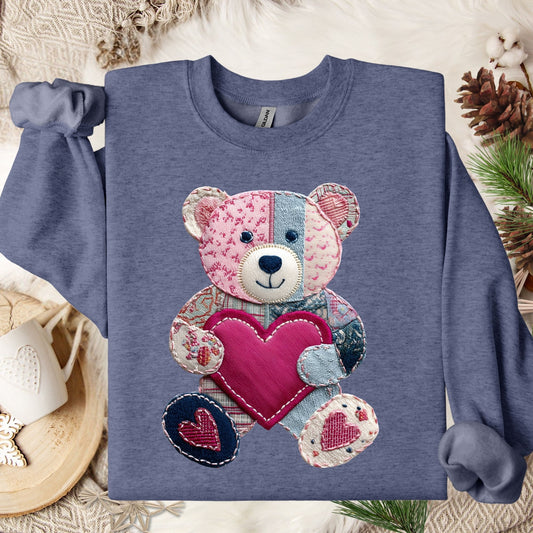 Heather Sport Dark Navy sweatshirt with a printed faux patchwork teddy bear holding a pink heart.