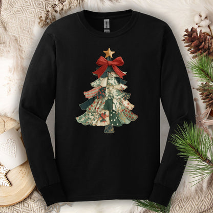 Black long sleeve tee with a cottagecore patchwork Christmas tree design and a red bow.