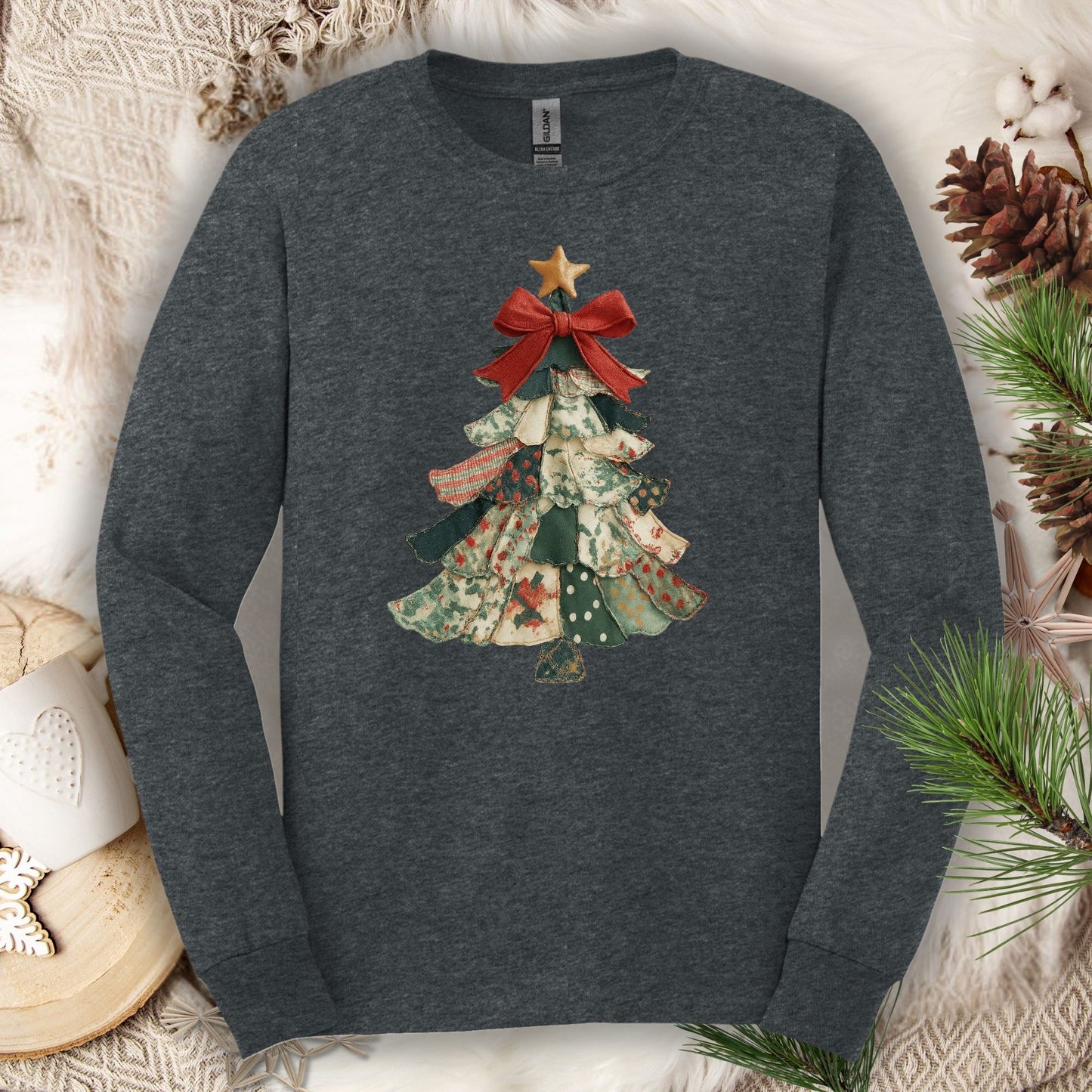 Dark Heather long sleeve tee with a vintage patchwork Christmas tree design, red bow, and gold star.
