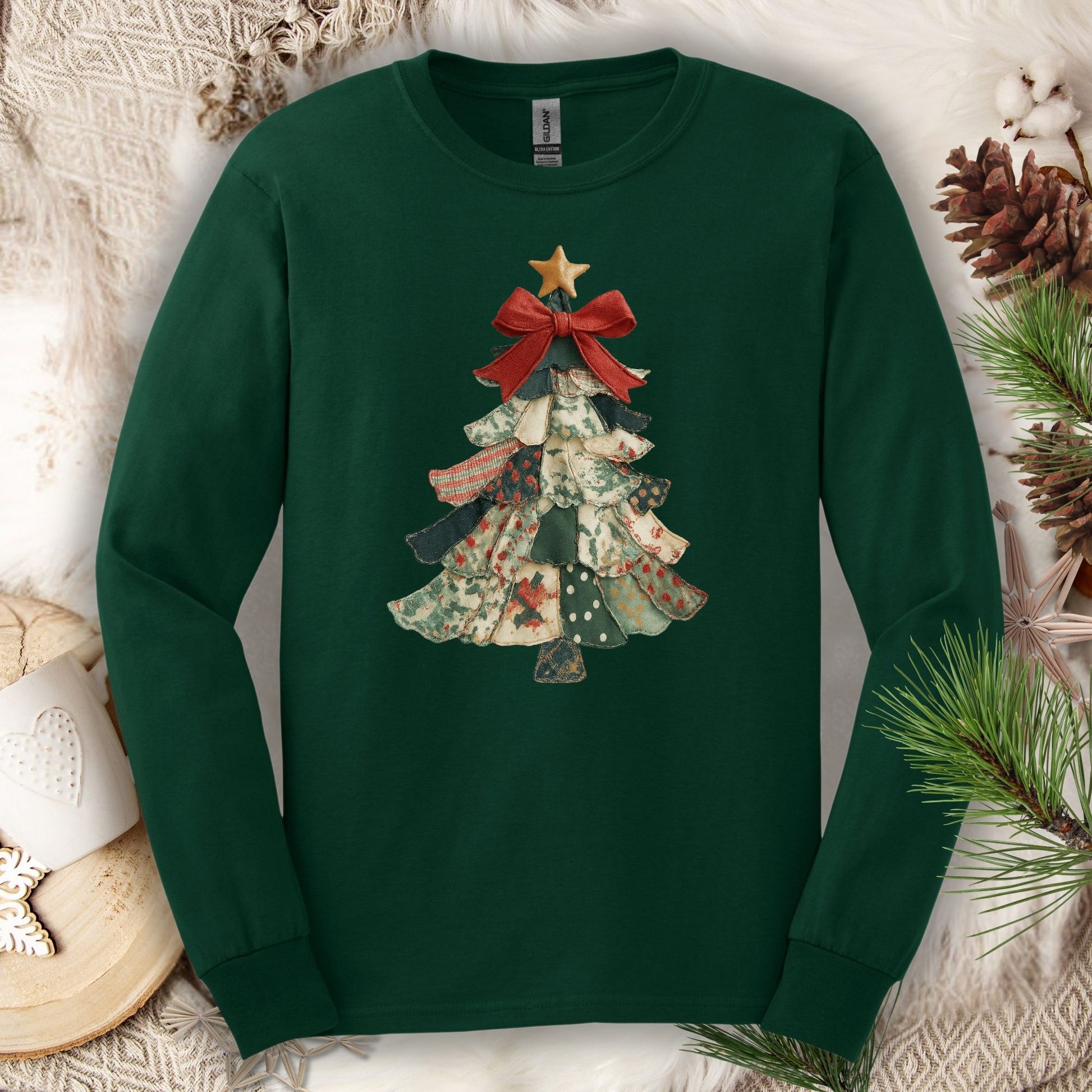 Forest Green long sleeve tee with a vintage patchwork Christmas tree design and red bow.