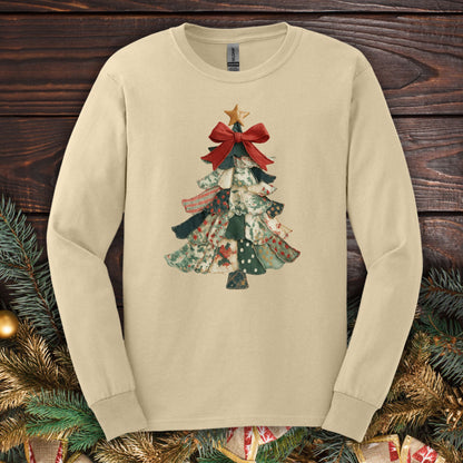 Sand long sleeve tee with a cottagecore patchwork Christmas tree design, red bow, and gold star.