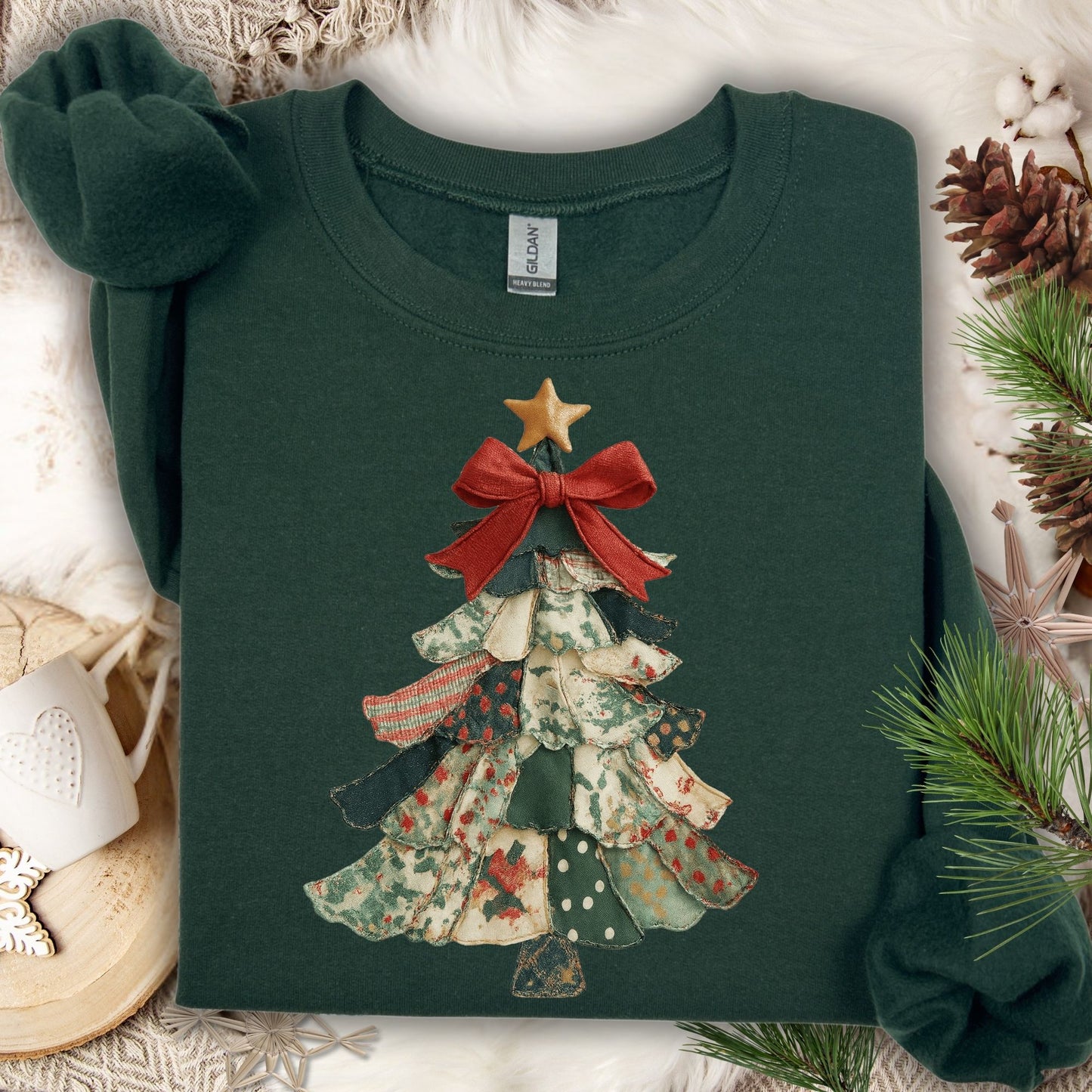 Forest Green S sweatshirt with a vintage-inspired patchwork Christmas tree design, red bow, and gold star.