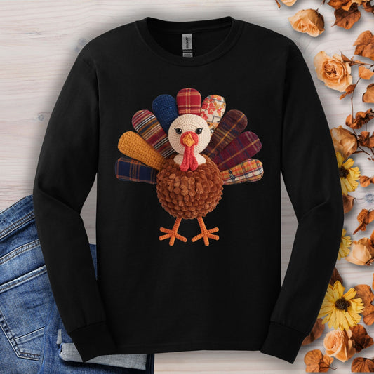 Black long sleeve tee with a faux patchwork turkey and hook yarn body.