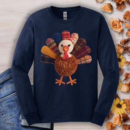 Navy long sleeve tee with a faux patchwork turkey and hook yarn body design.