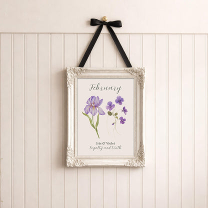 February birth flower art print in an ornate white frame with purple iris and violet flowers.