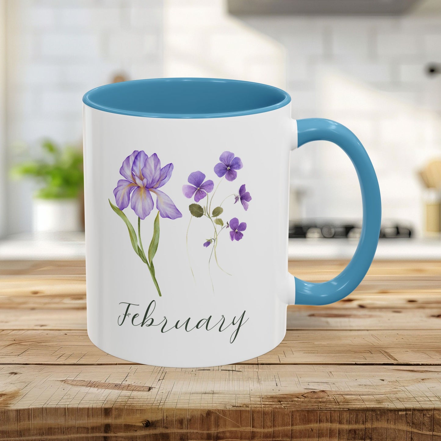White ceramic 11oz mug with light blue interior and handle, featuring watercolor purple iris and violet flowers for February.