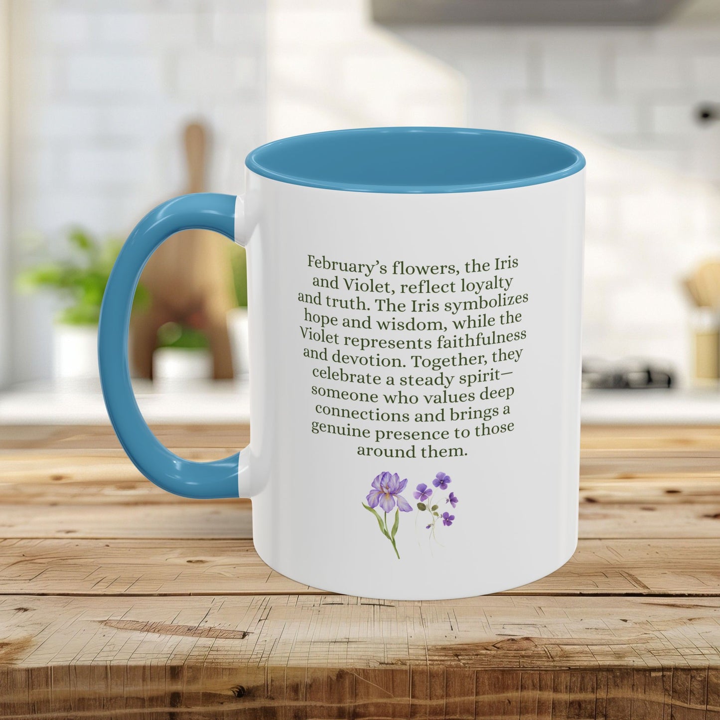 White ceramic mug with blue handle and interior, featuring text about February flowers and a watercolor iris and violet design.