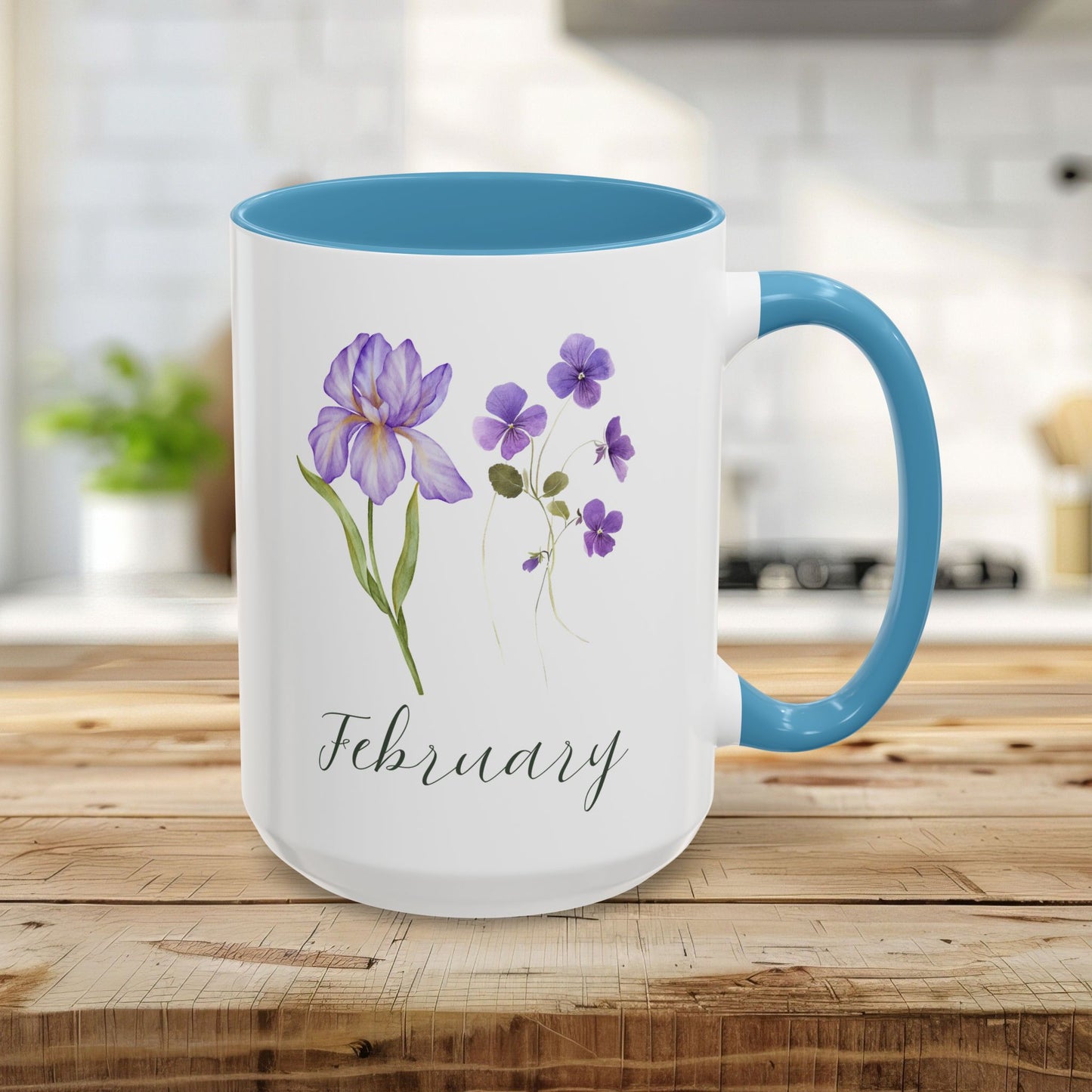 White ceramic 15oz mug with light blue interior and handle, featuring watercolor purple iris and violet flowers and "February".