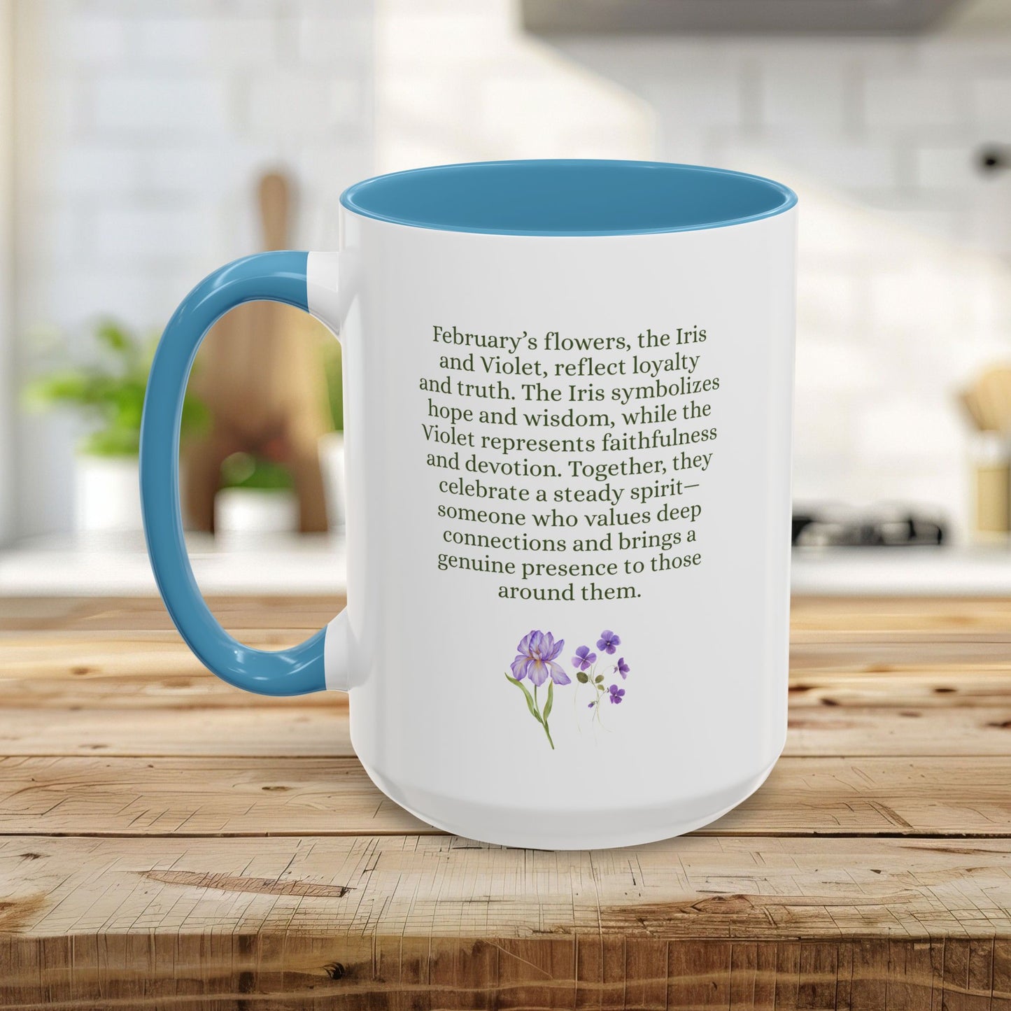 White ceramic mug with blue handle and interior, featuring text about February birth flowers and watercolor iris and violet blooms.