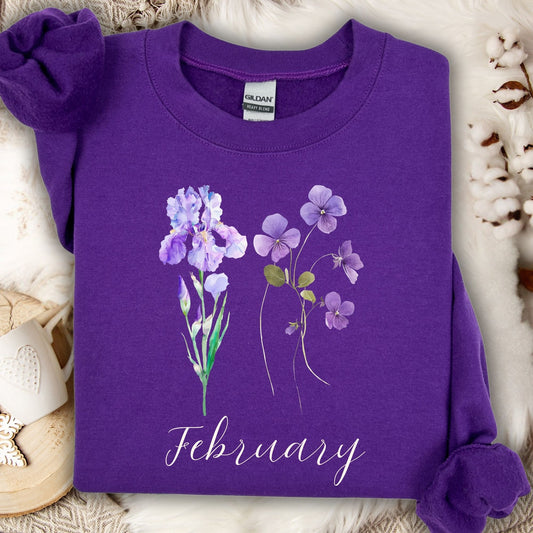 Purple crewneck sweatshirt with watercolor iris and violet flowers, "February" text.
