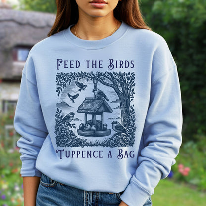 Light blue unisex crewneck sweatshirt with a vintage "Feed the Birds" illustration and text.