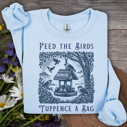 Light blue vintage sweatshirt with "Feed the Birds, Tuppence a Bag" text and bird feeder illustration.