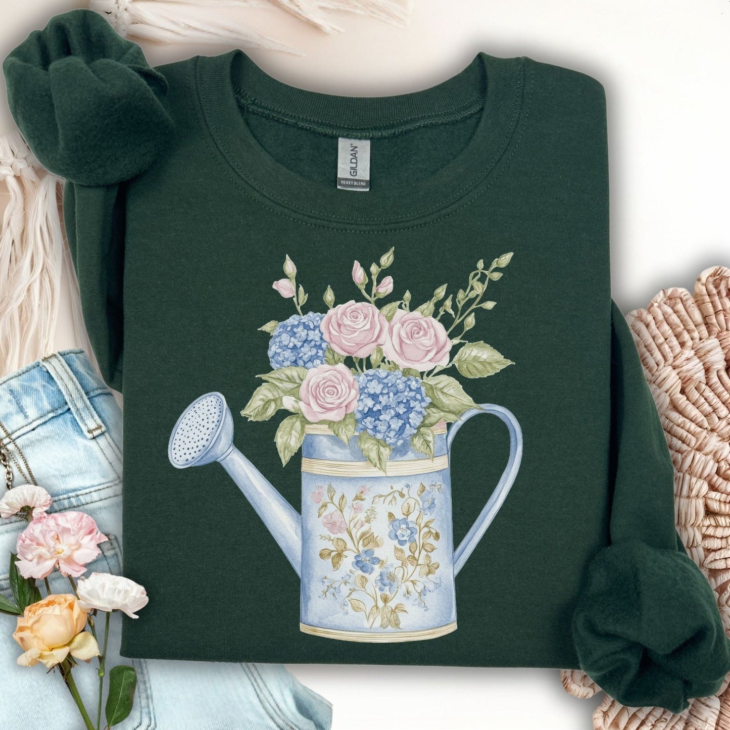 Forest Green crewneck sweatshirt with a watercolor watering can full of pink roses and blue hydrangeas.