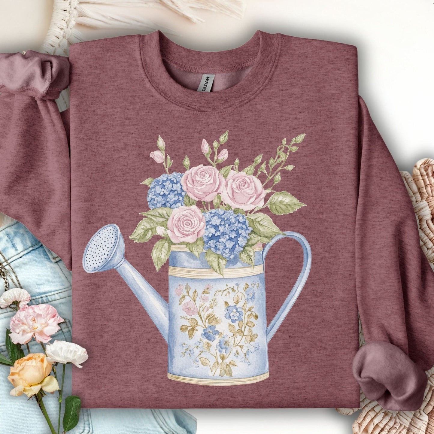 Heather Sport Dark Maroon sweatshirt with a watercolor watering can full of pink roses and blue hydrangeas.