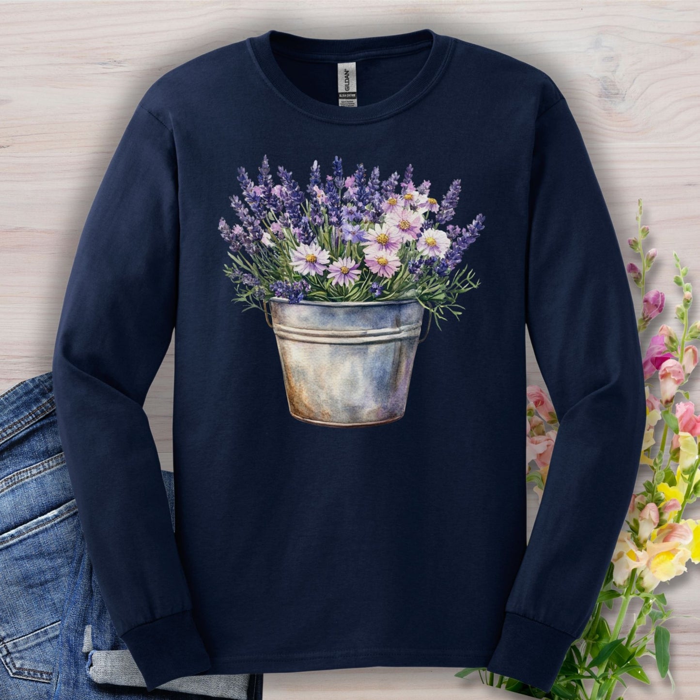 Navy long sleeve tee with a hand-painted bucket of lavender and daisies.