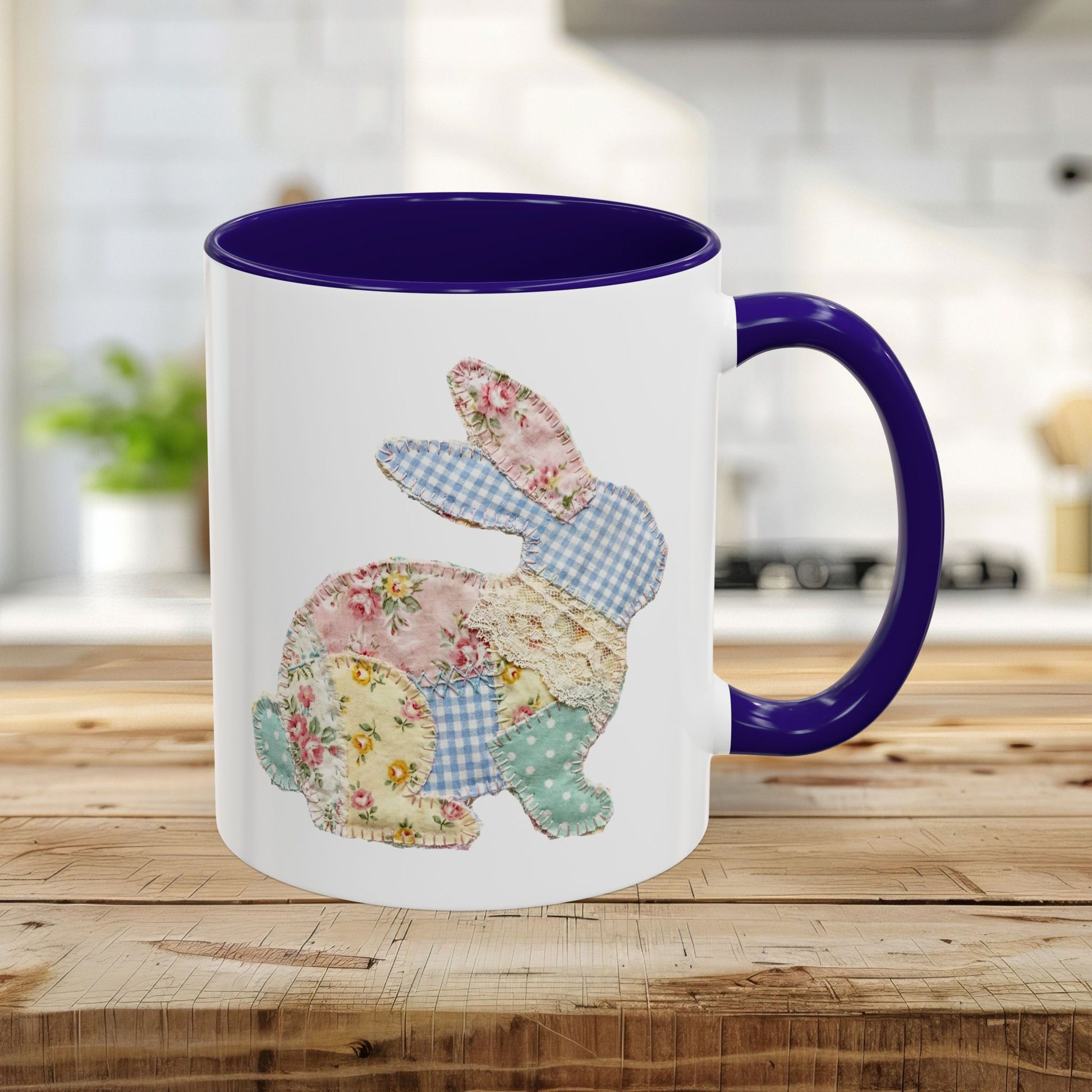 White ceramic mug with a purple handle and interior, featuring a patchwork floral Easter bunny design.